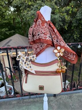Dooney & Bourke Cream and Brown Trim Leather Crossbody with Charms